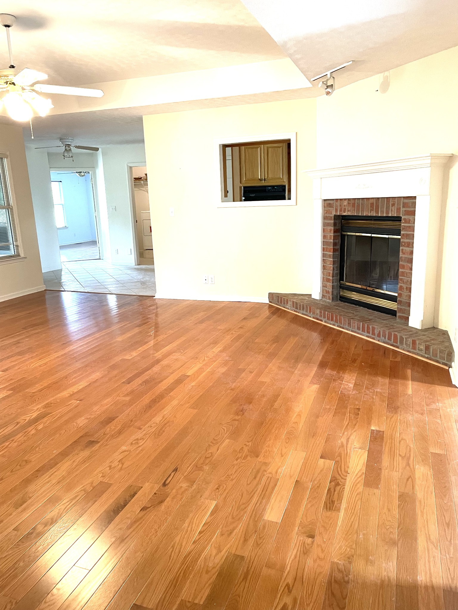 Living Room w/Fireplace into Kitchen and toward Master Suite