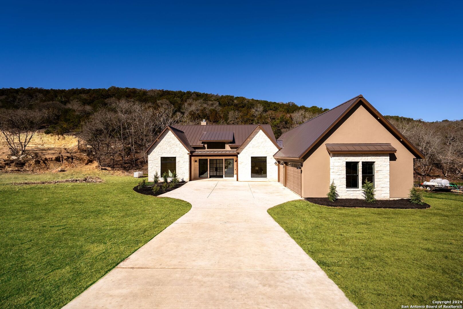 a front view of a house with a yard