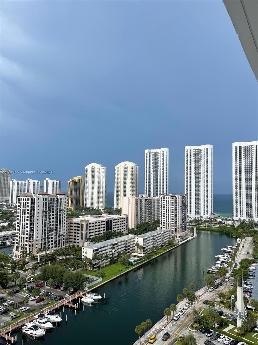 a view of a lake with tall buildings