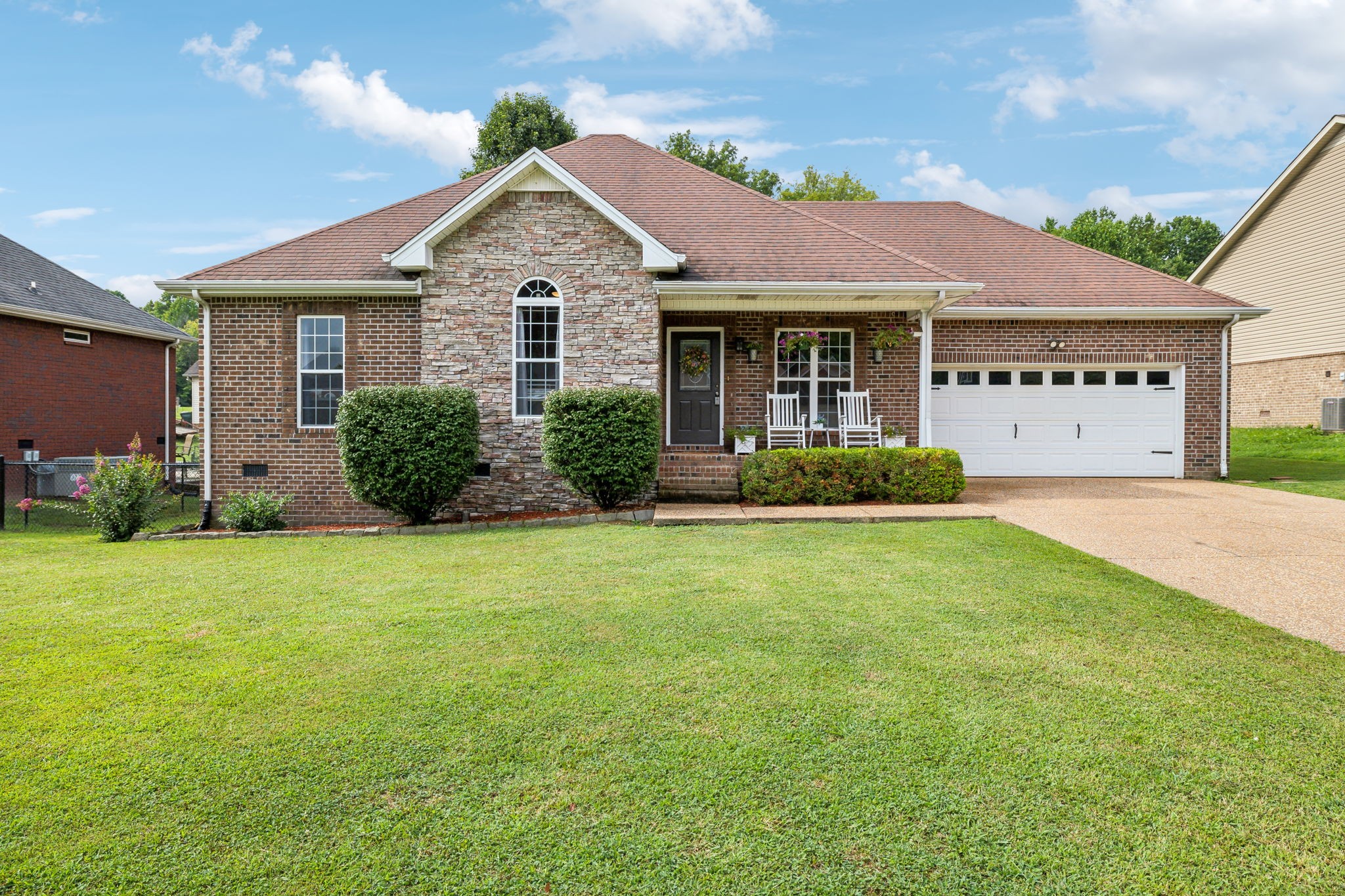 a front view of a house with garden