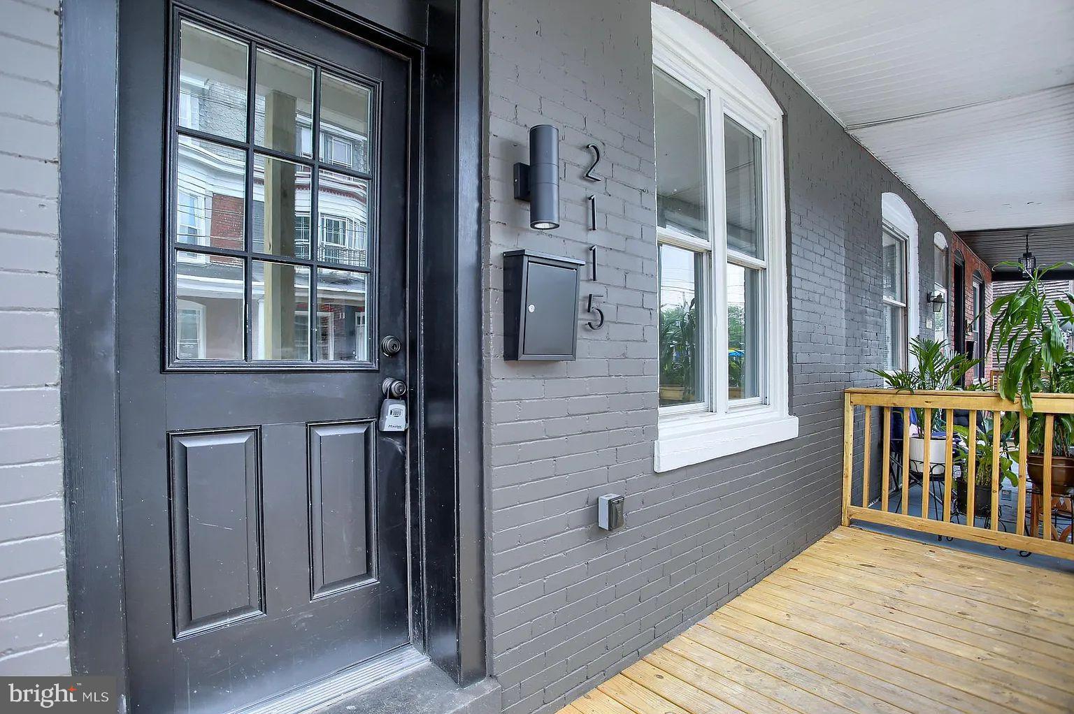 a view of an entryway of house with wooden floor