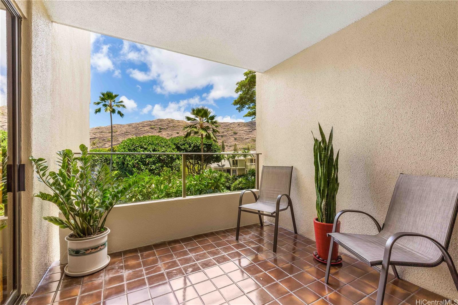 a view of a chairs and table in patio