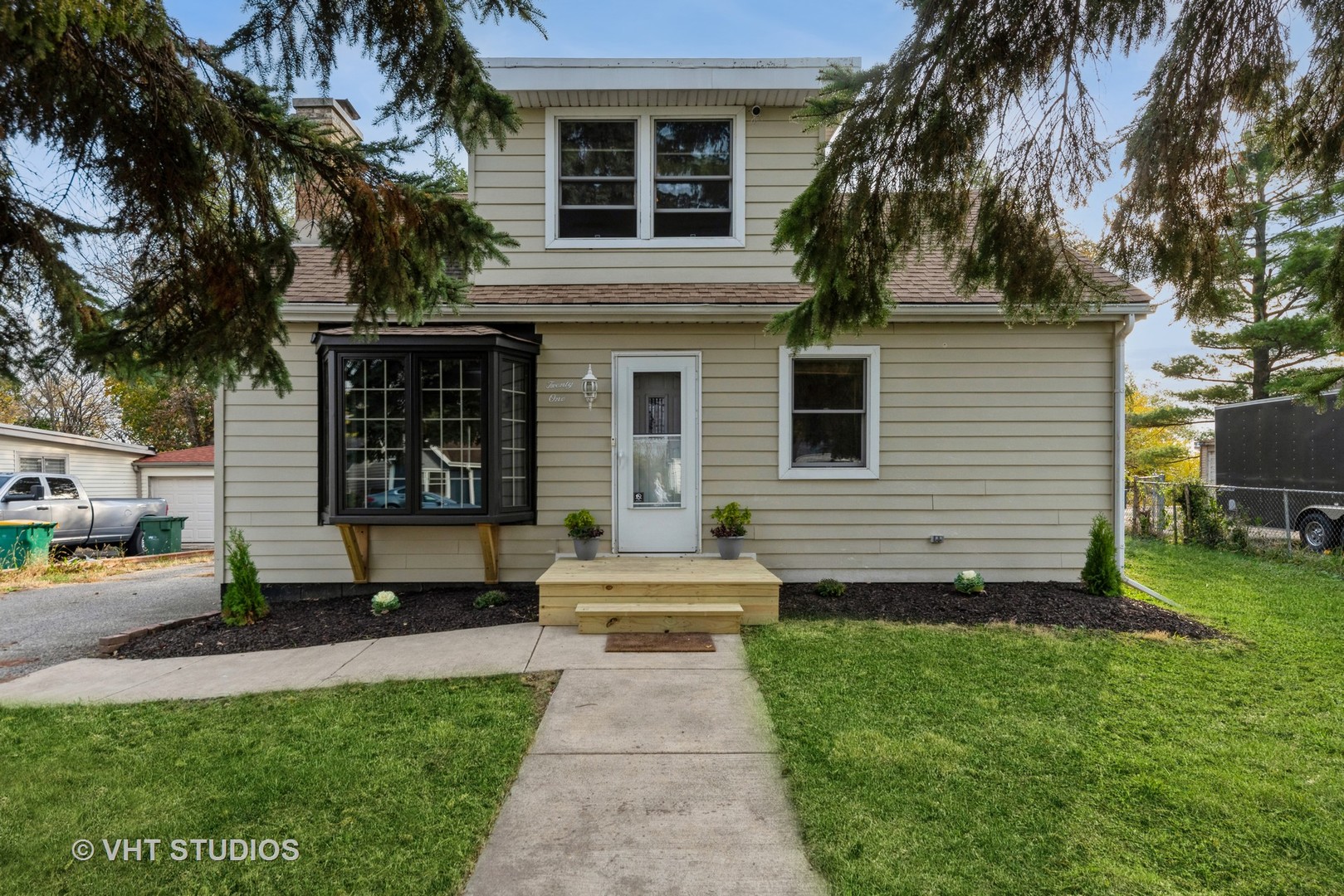 a front view of a house with a yard