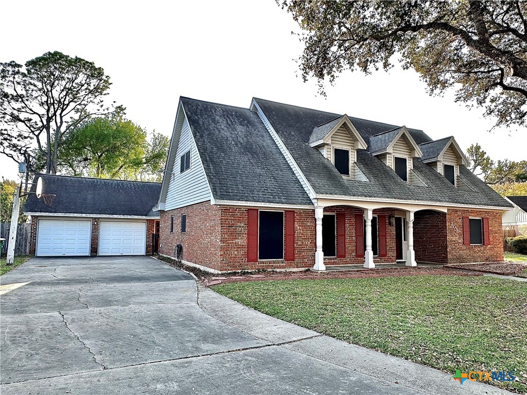 front view of a house with a small yard