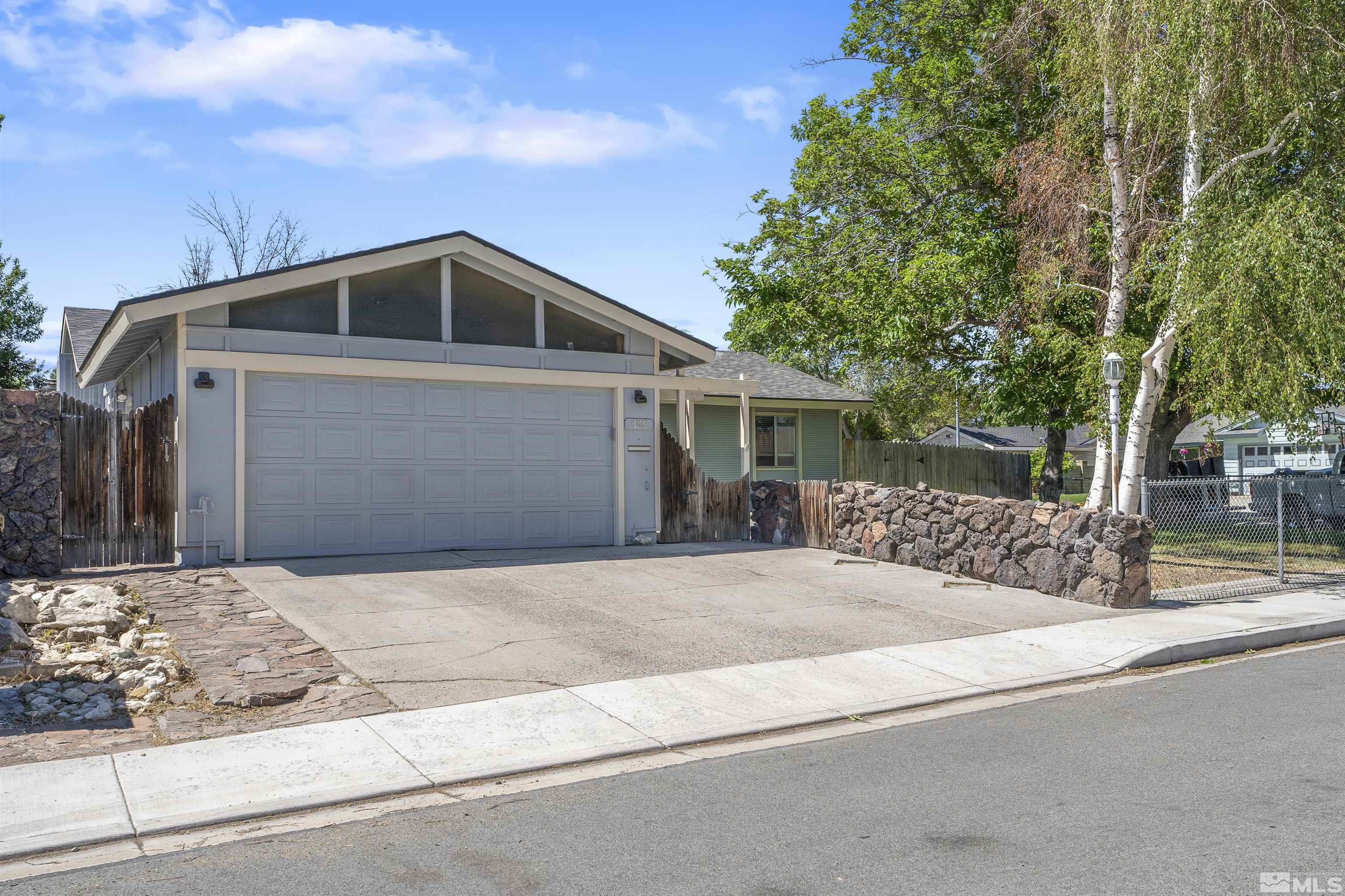 a front view of a house with a garage