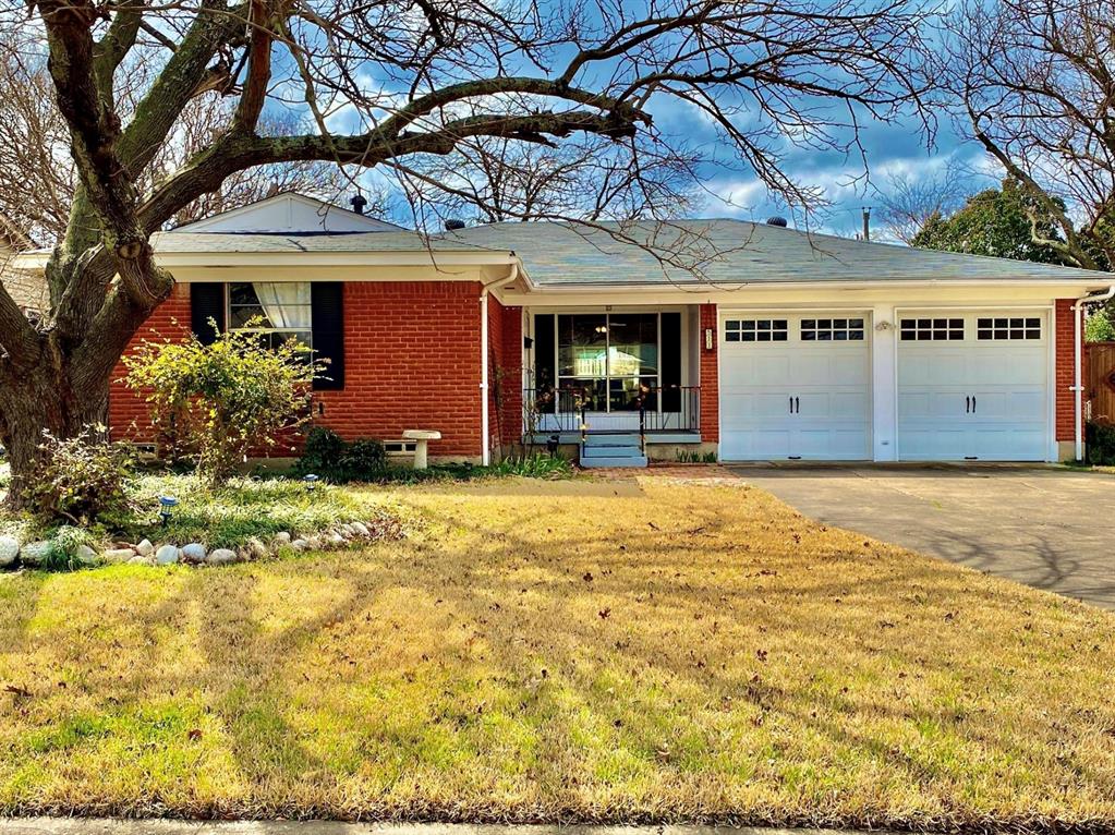 front view of a building with a yard