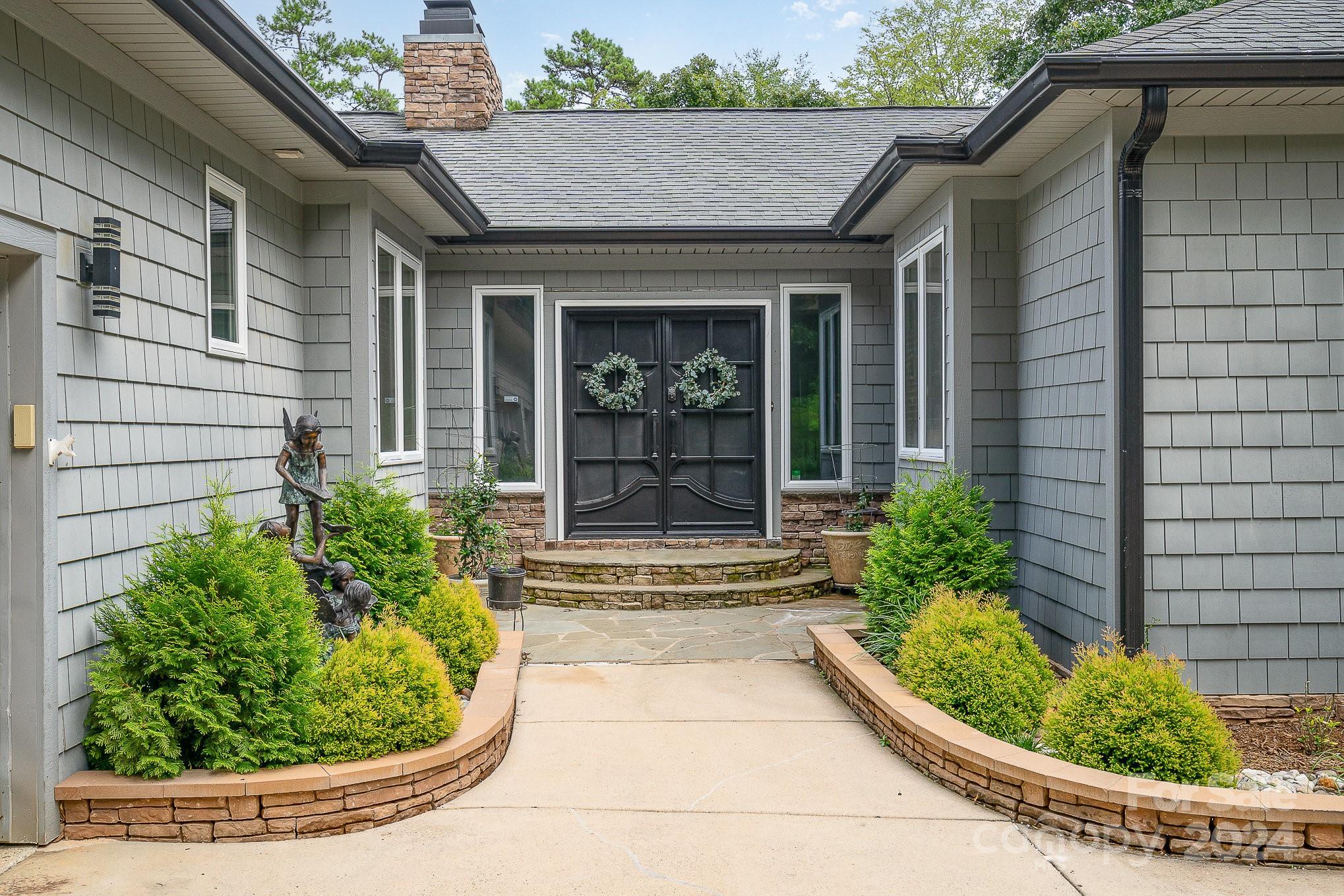 a view of a house with a small garden