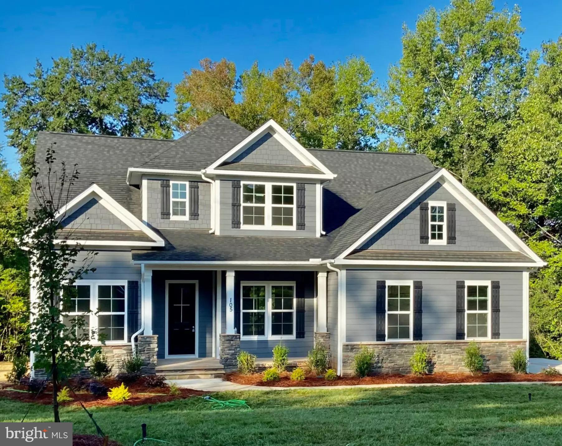 front view of a house with a yard