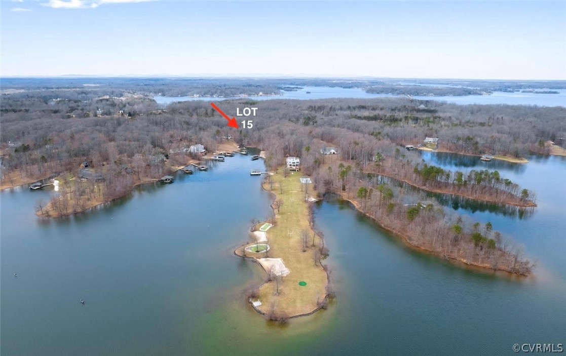 an aerial view of a house with a lake view