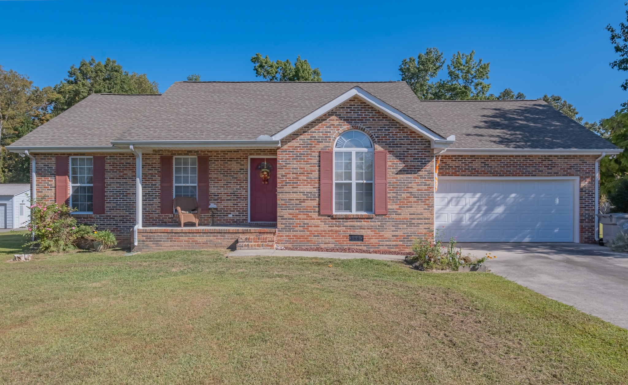 front view of a house with a yard