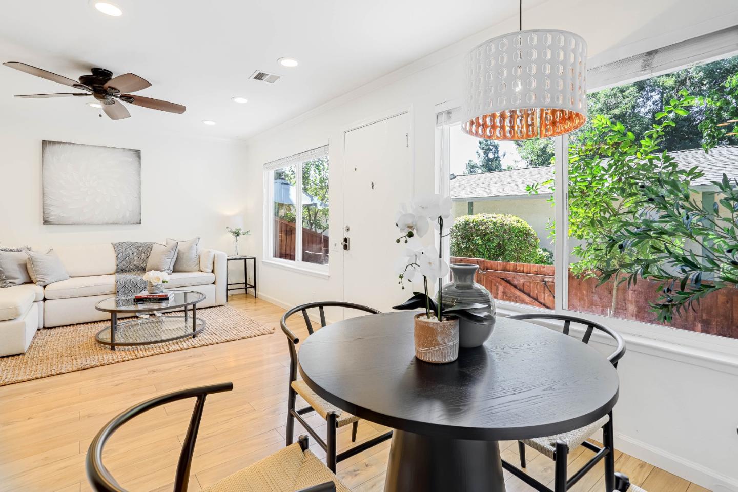 a dining room with furniture and a chandelier