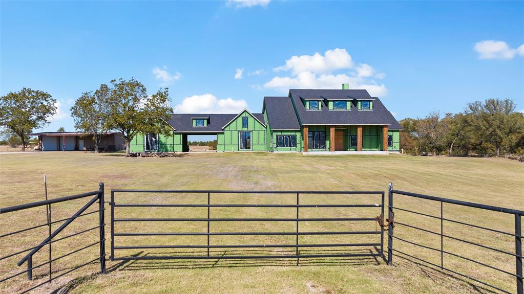 a view of a house with a iron gate