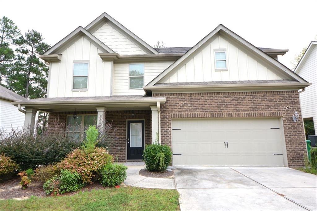 a front view of a house with yard