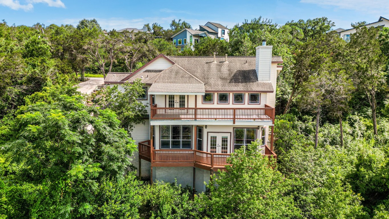 front view of a house with a tree