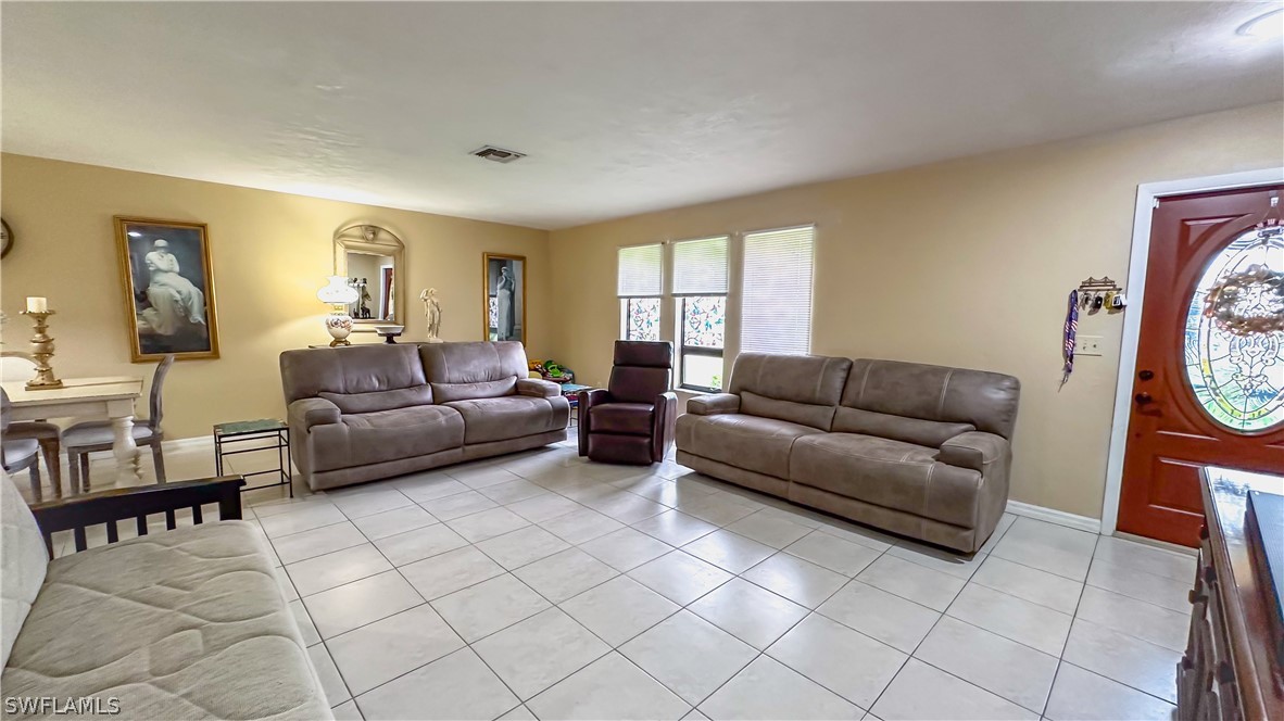 a living room with furniture and a window