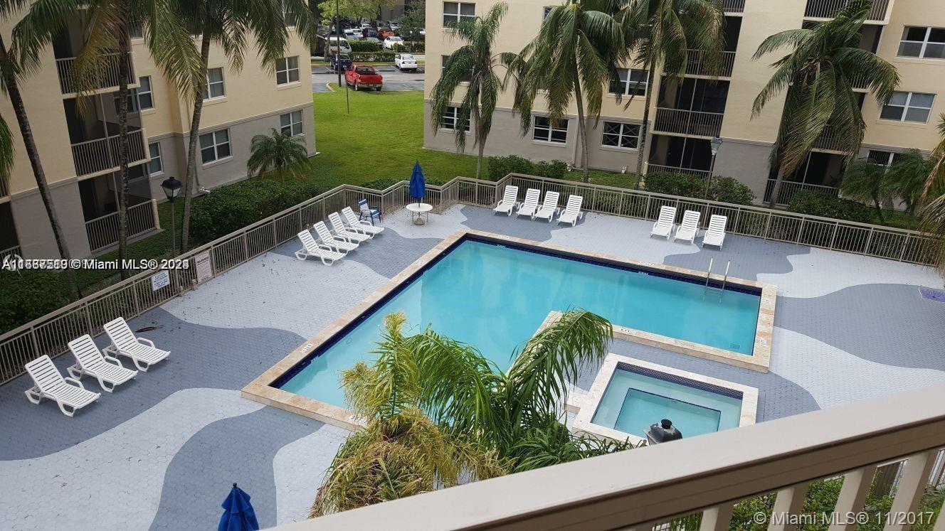 a view of swimming pool with chairs