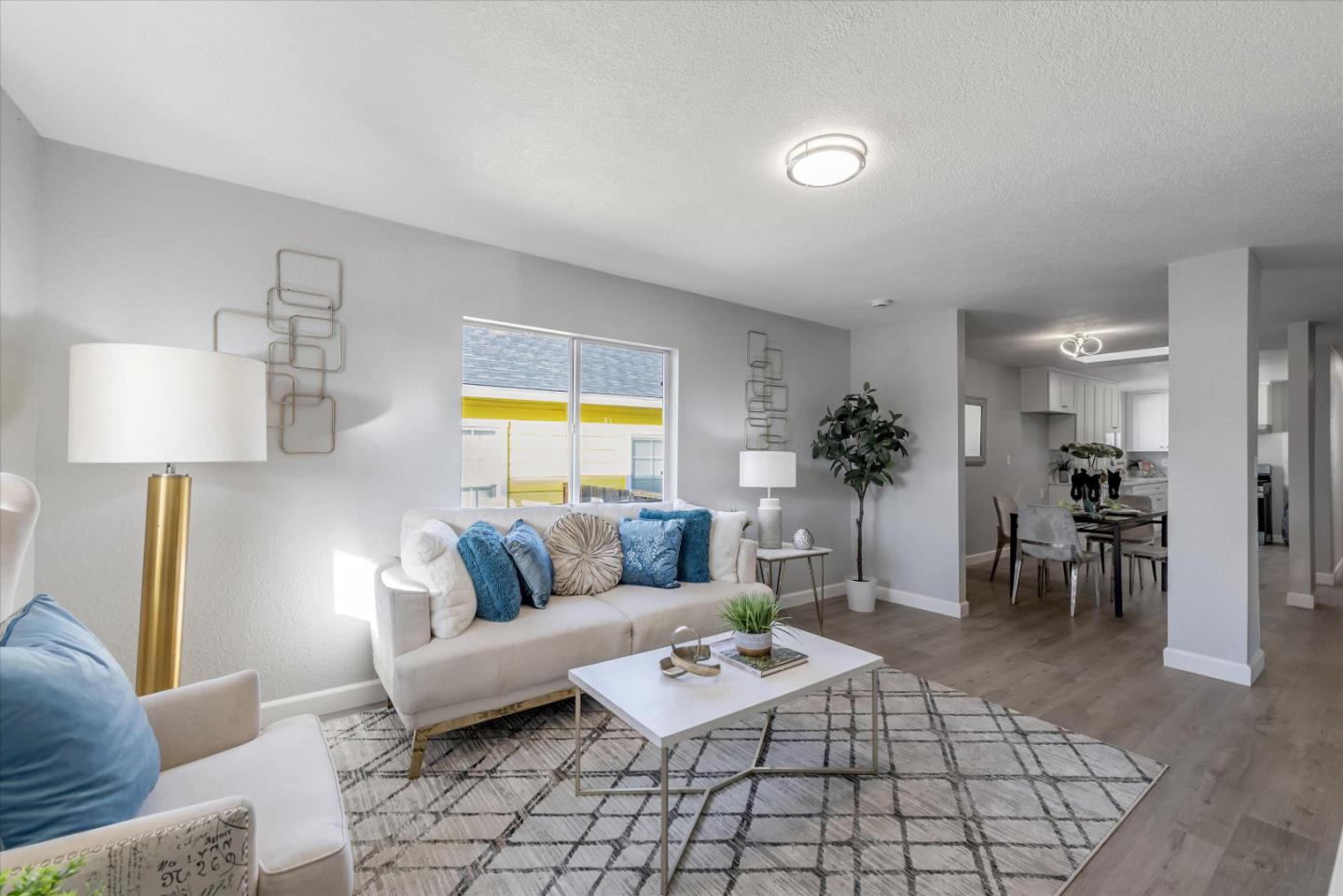 a living room with furniture and a table