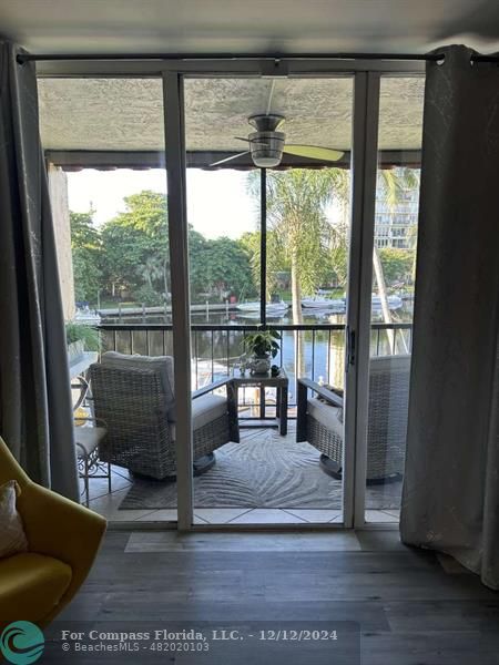 a living room with a large window and a table