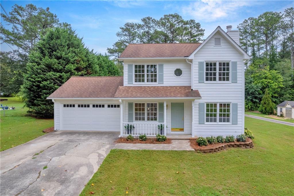 front view of a house with a yard