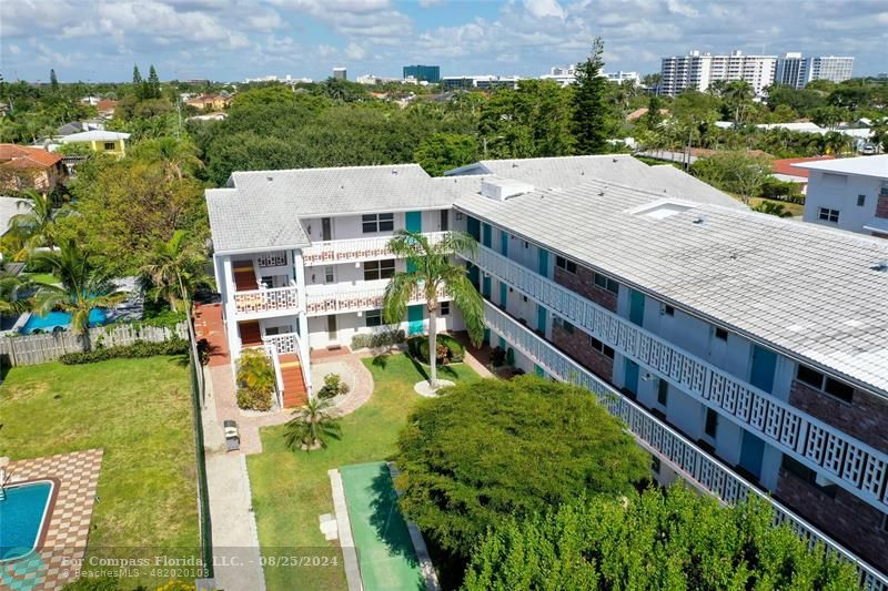 an aerial view of a house with a garden