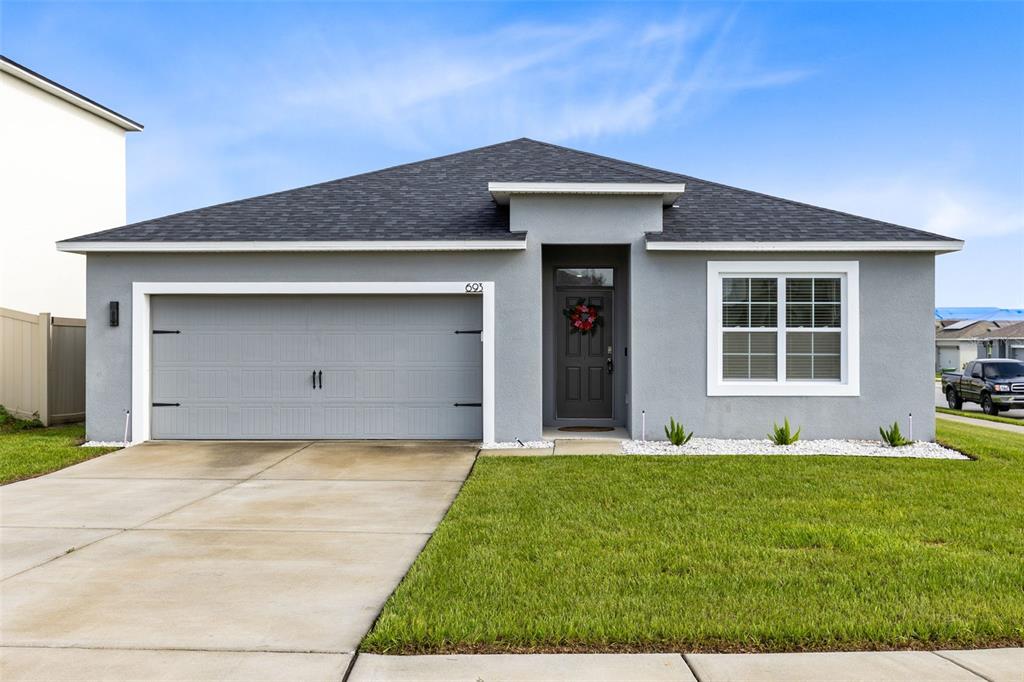 a front view of a house with yard