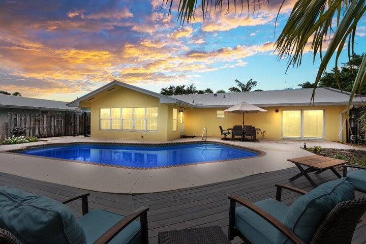 a view of swimming pool with seating area