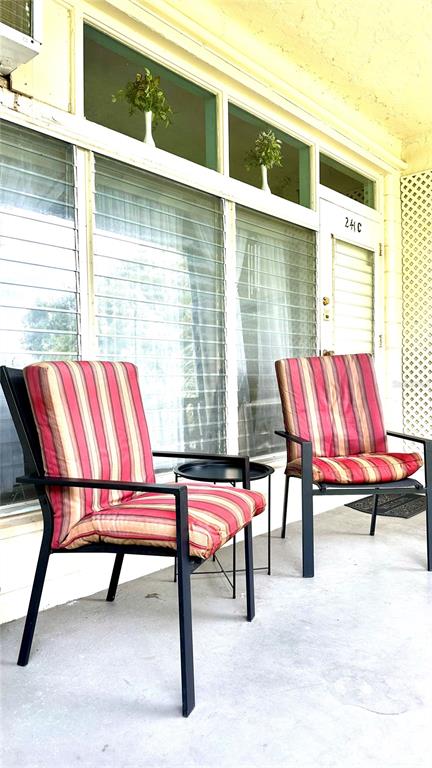 a building with a bench and chairs