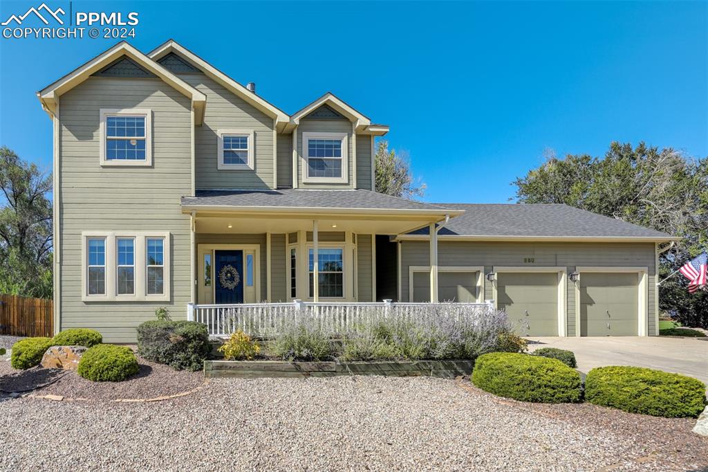 front view of a house with a yard