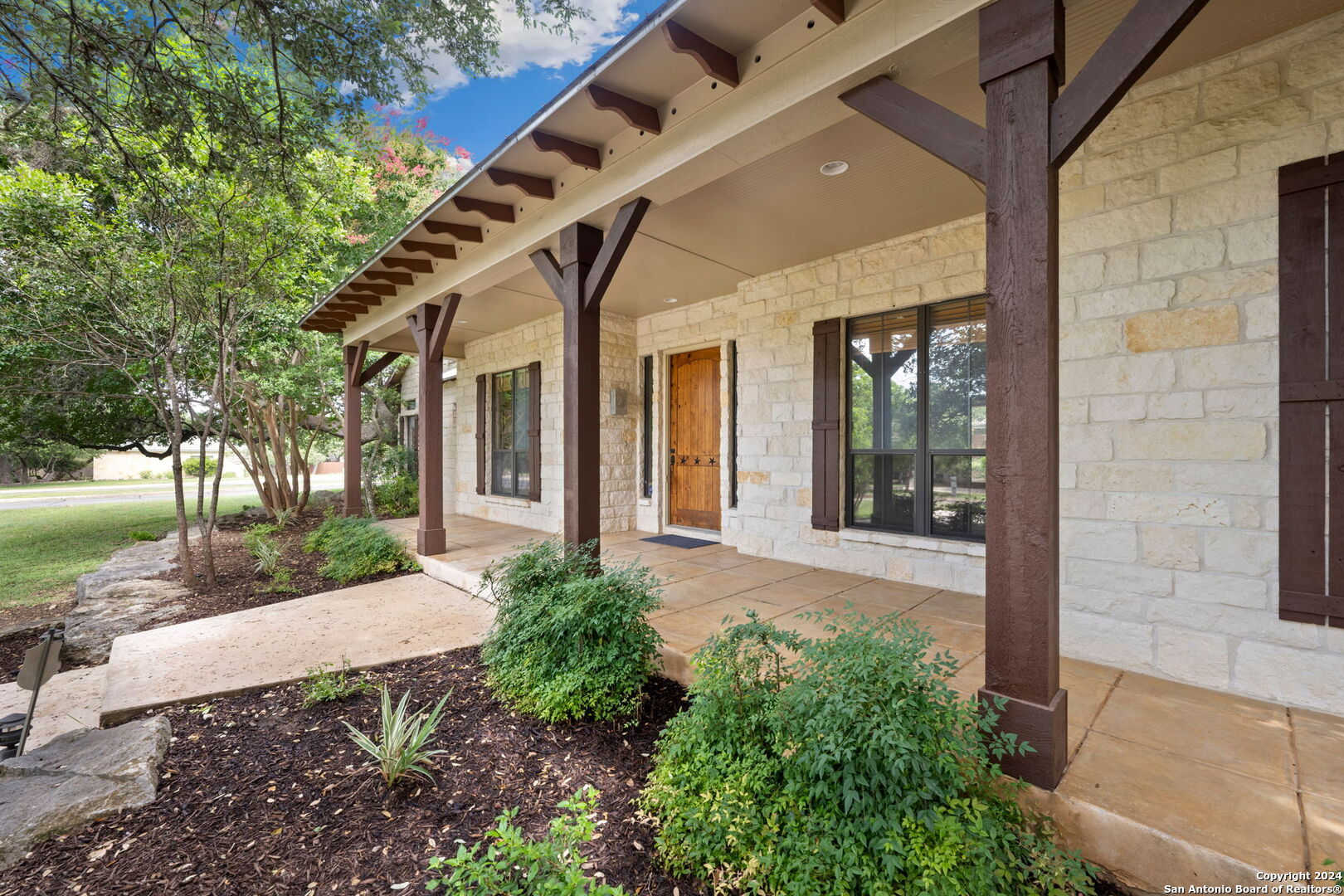 front view of a house with a yard