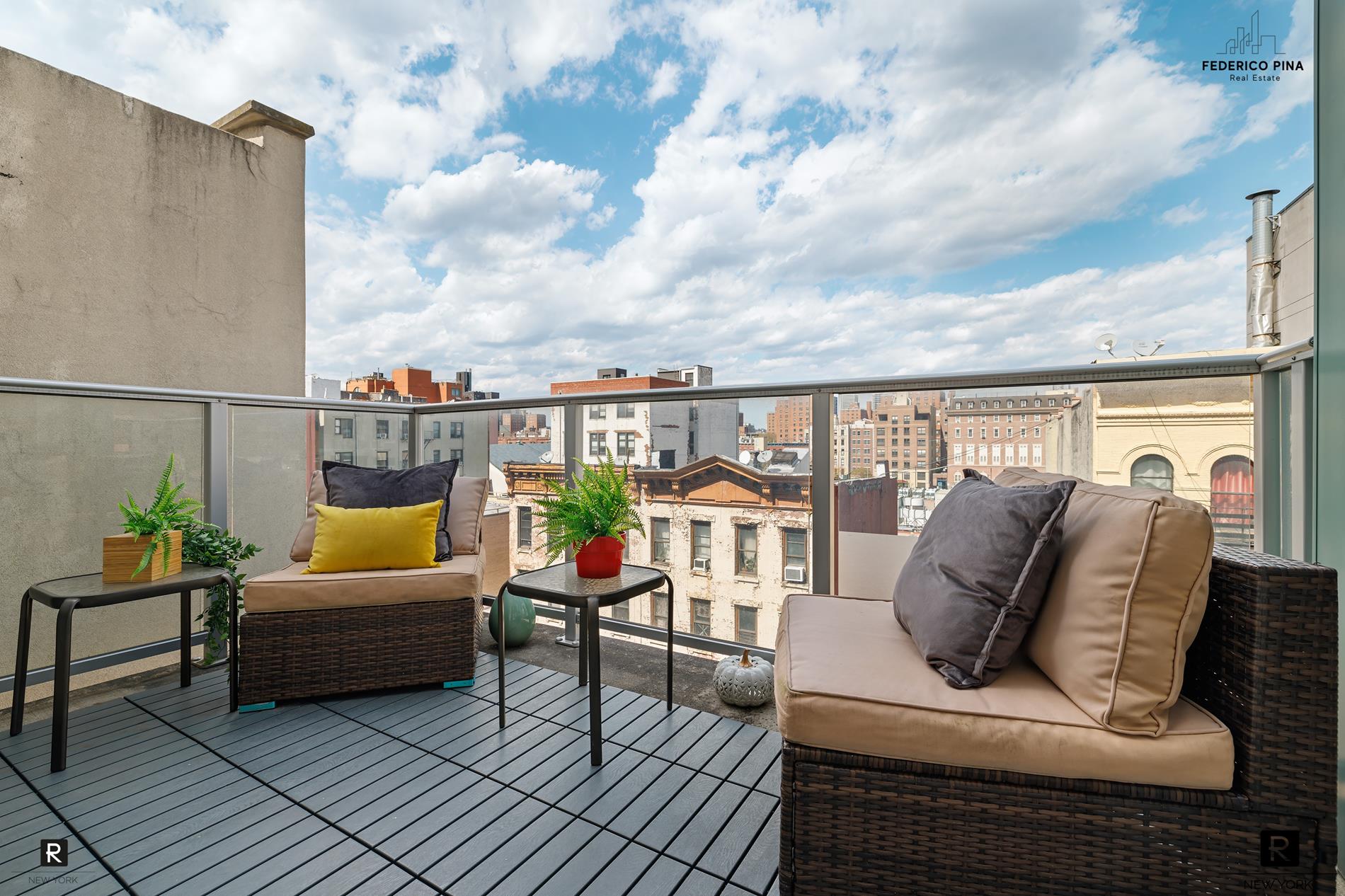 a balcony with furniture and city view