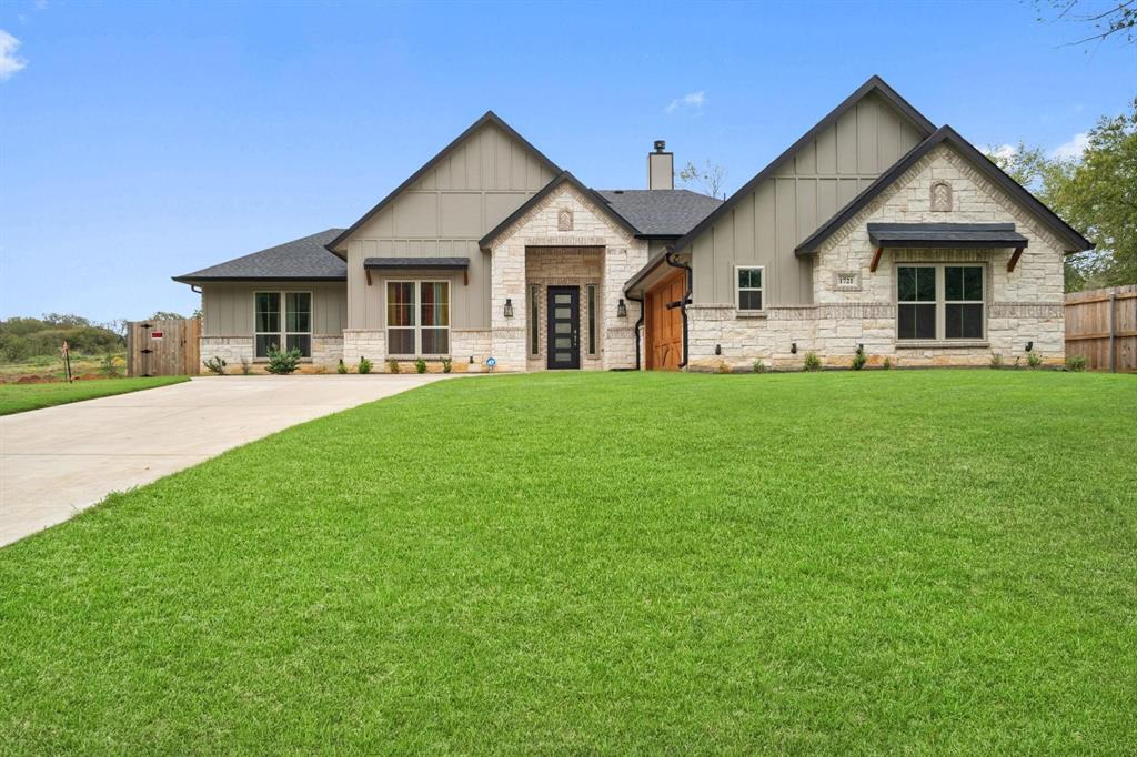 a view of a house and a yard with green space