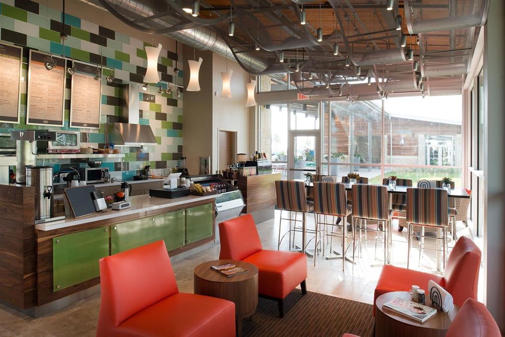 a dining room with lots of tables and chairs