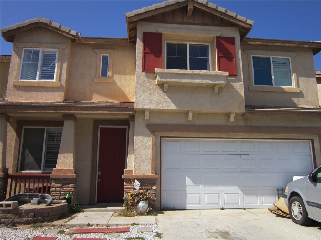 a front view of a house with parking