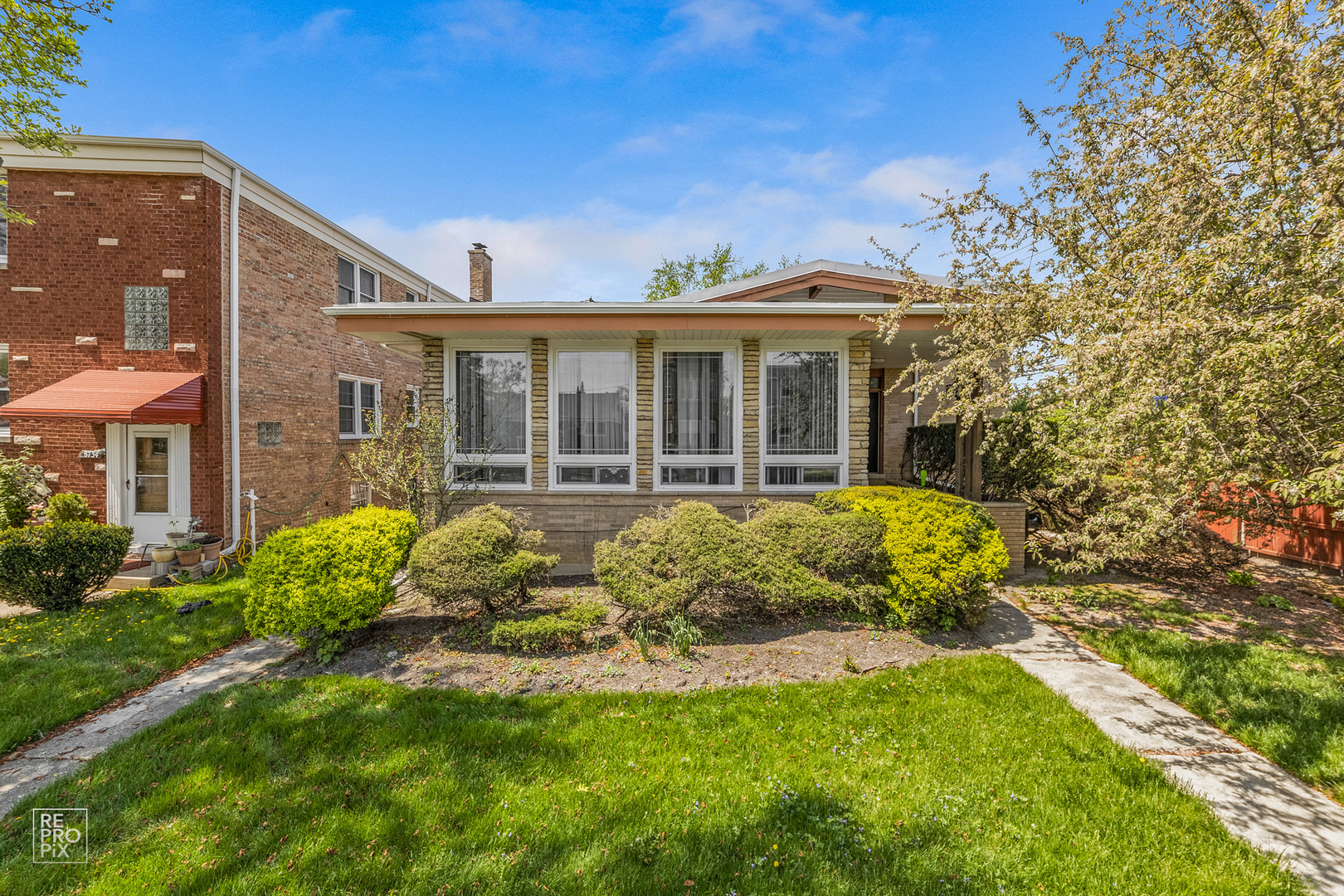 a front view of a house with a yard