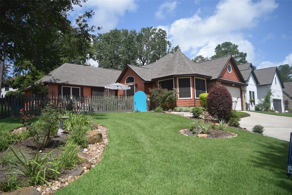 a front view of a house with a garden and porch