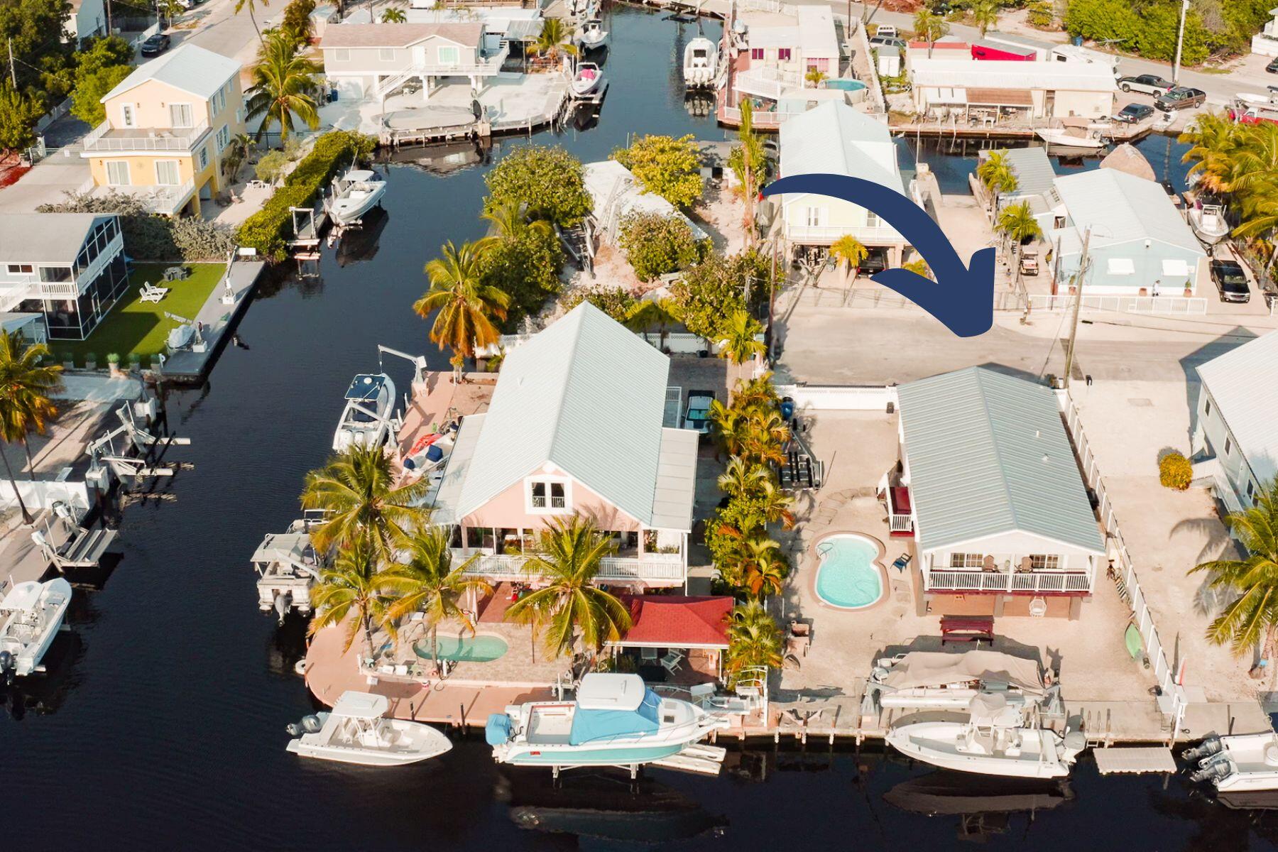 an aerial view of a houses with yard