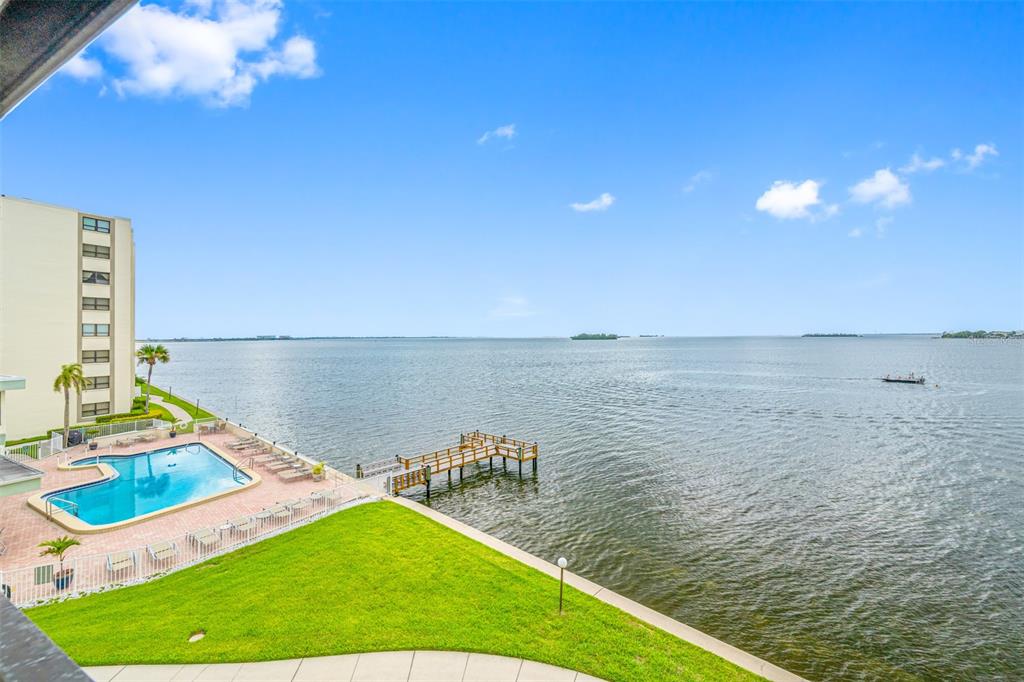 a view of a swimming pool with an ocean view