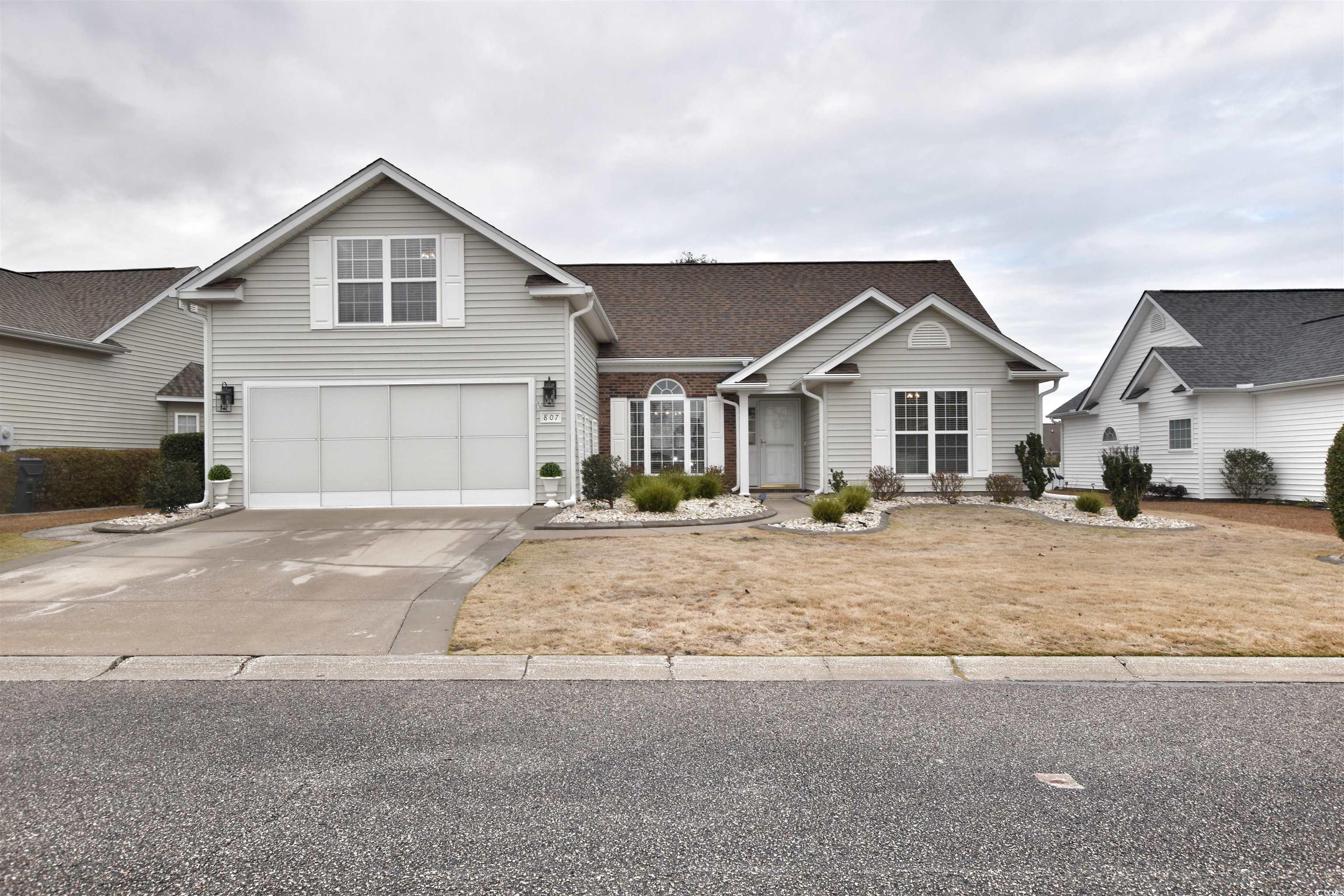 View of property featuring a garage