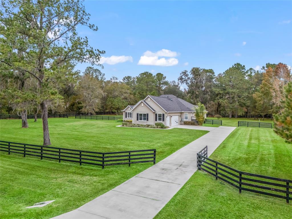 a view of a house with a big yard