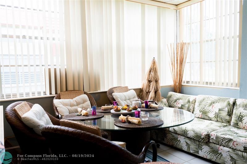 a living room with furniture and window