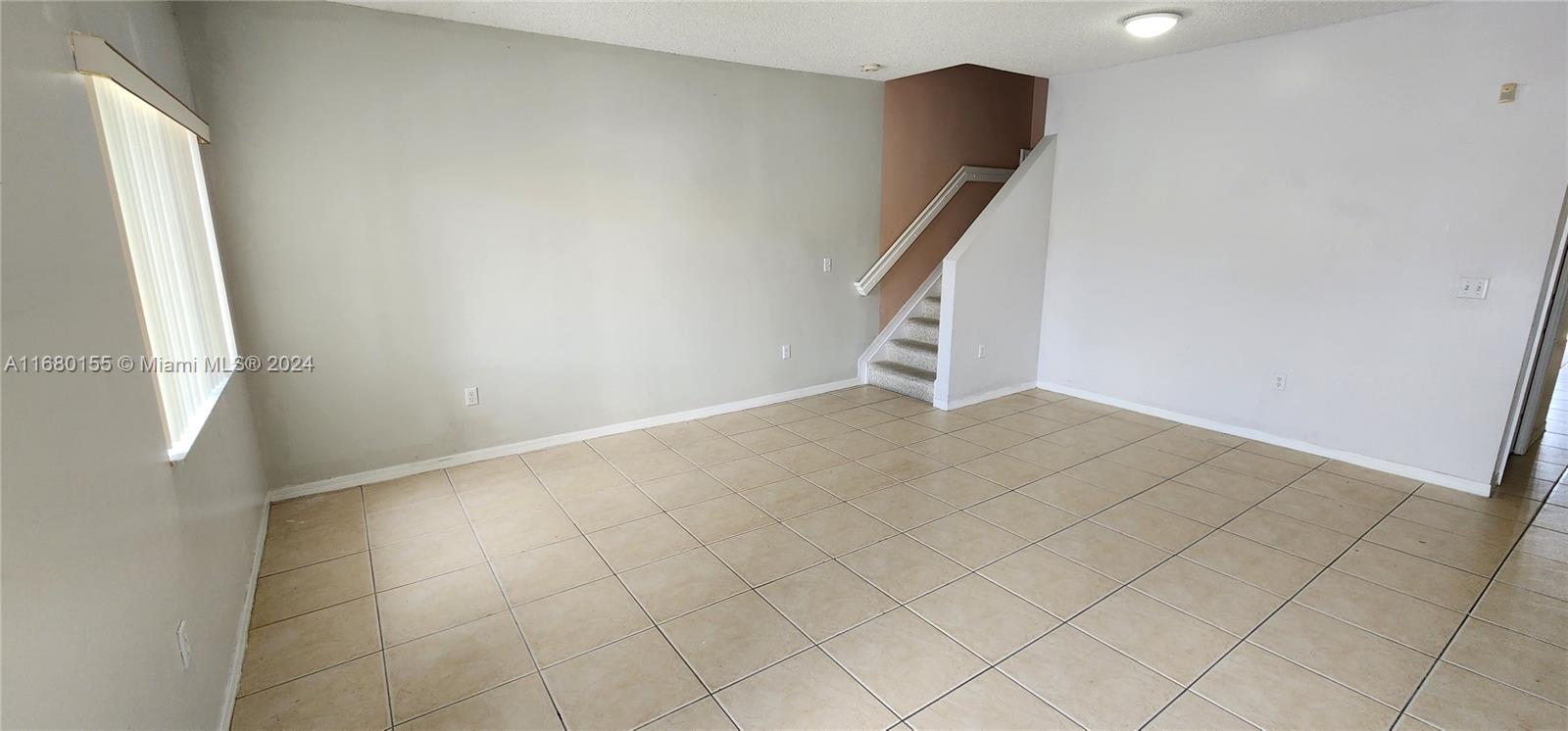 an entryway in staircase with white walls