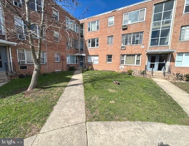 a view of a building with a yard