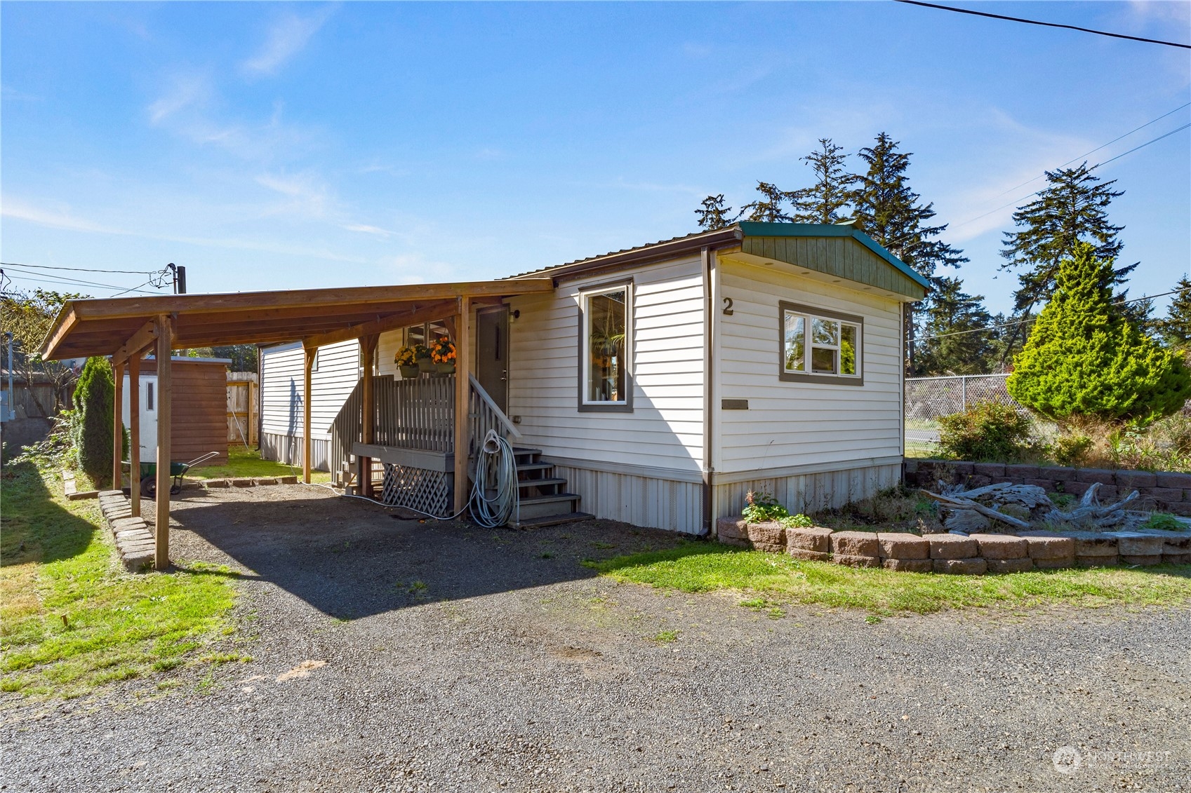 a view of a house with backyard and porch