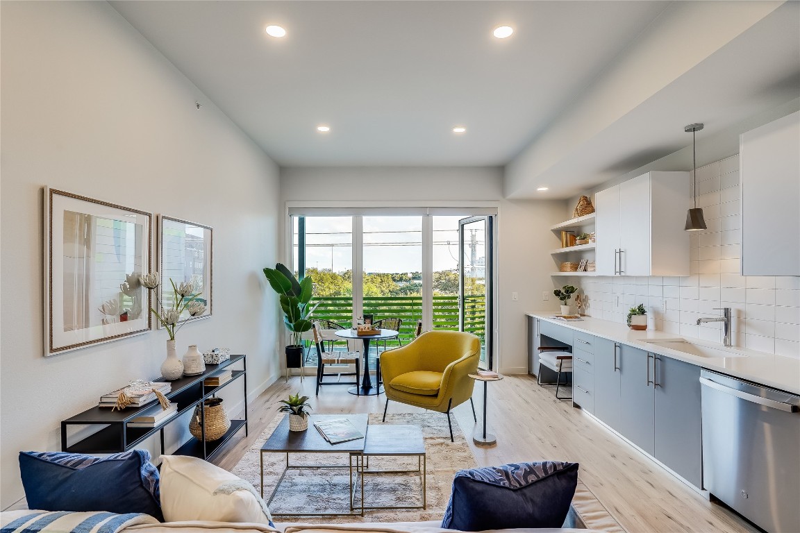 a living room with furniture and a large window