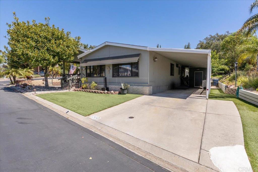 a house with palm tree in front of it