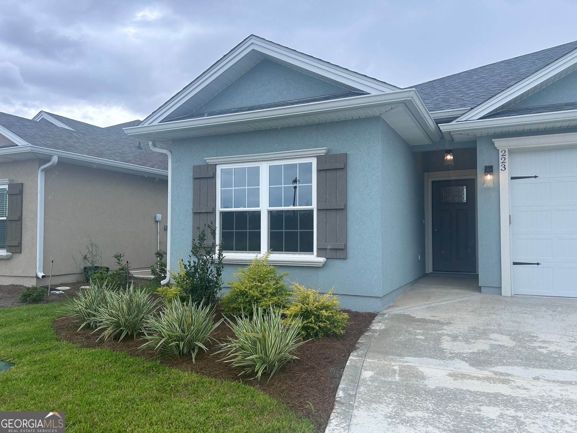 a front view of a house with a yard