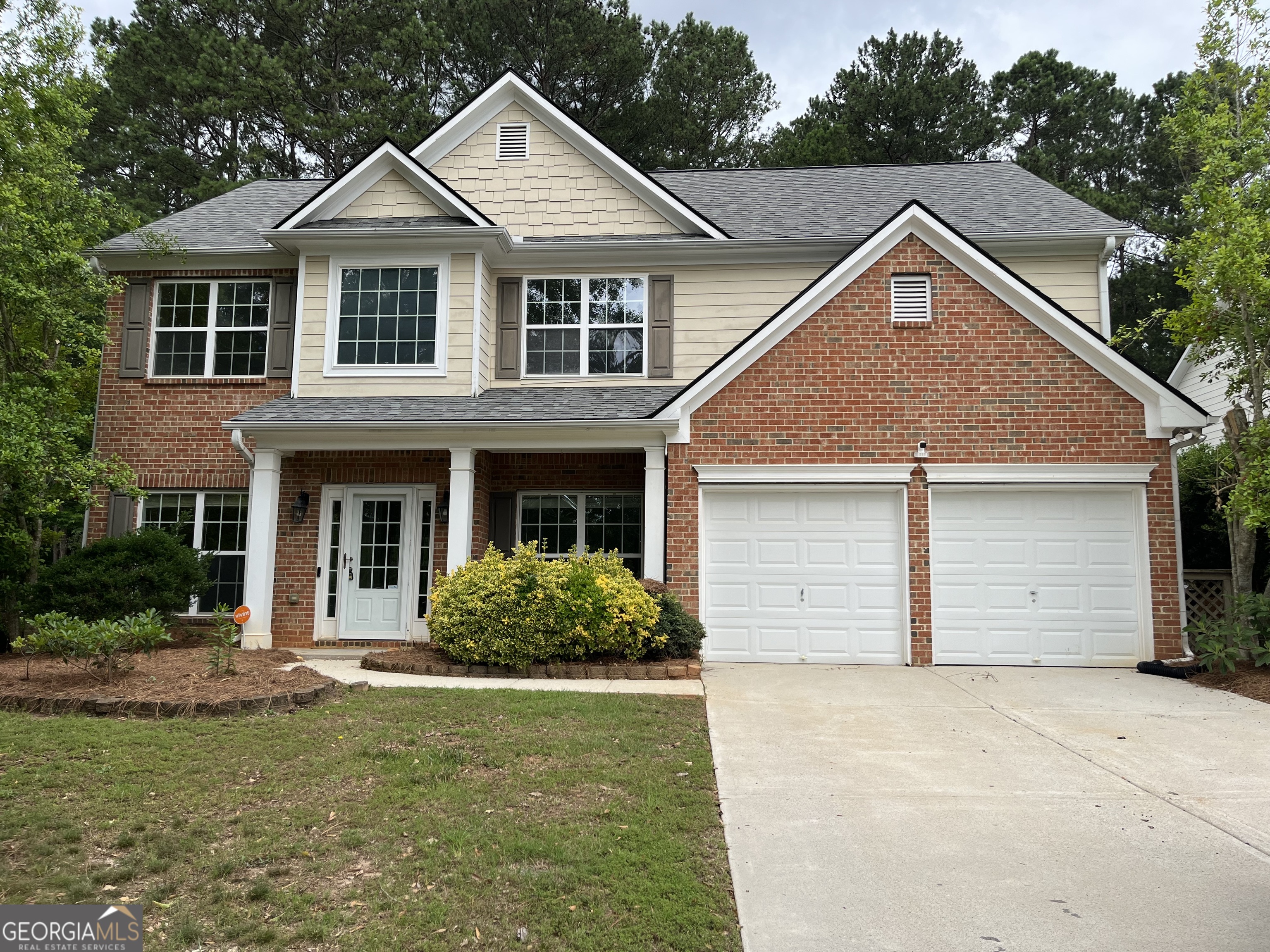 a view of a yard in front view of a house