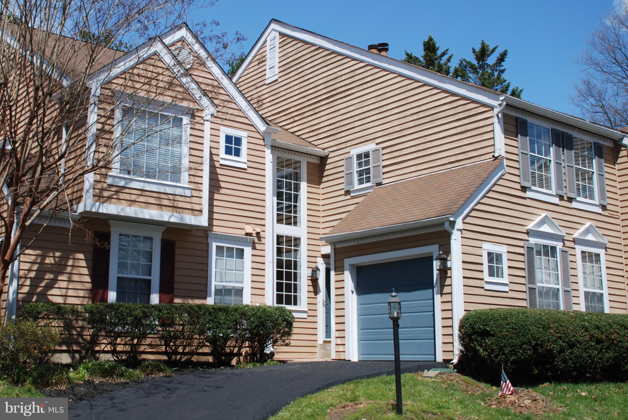 a view of a house with a yard and plants