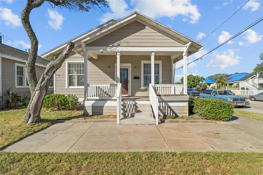 front view of a house with a bench