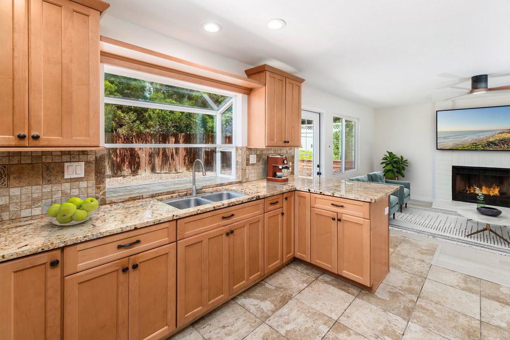 a kitchen with a sink and a window